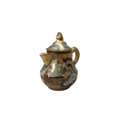 An ornamental teapot that stands out for its rich decoration and traditional style. The body of the teapot is decorated with depictions of figures – possibly monks or mythological characters – integrated into a design featuring geometric patterns and dark backgrounds, accentuated by gold-coloured details. Available for hire for events, advertising, films and TV series.