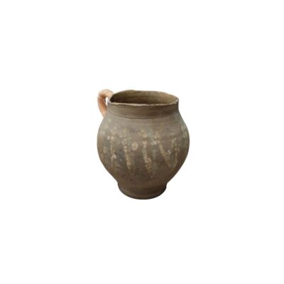 A ceramic vessel in earthy tones with an aged appearance, characterised by a globular body, a circular base and a single side handle with a textured finish in light colours; available for hire for events, advertising, films and TV series