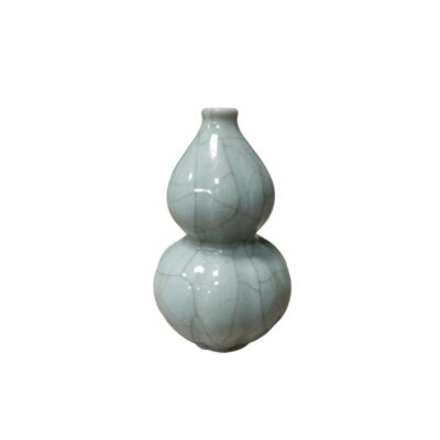 A ceramic vase with a distinctive double pumpkin-shaped silhouette, characterised by a soft glaze in greenish celadon tones and a characteristic crackled finish with fine dark lines across its entire surface; available for hire for events, advertising, films and TV series