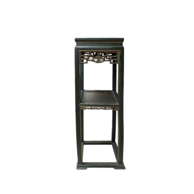 A tall wooden shelving unit with a dark finish, characterised by a rectangular structure with clean, straight lines, a middle storage level and delicate openwork detailing beneath the top shelf; available for hire for events, advertising, films and TV series