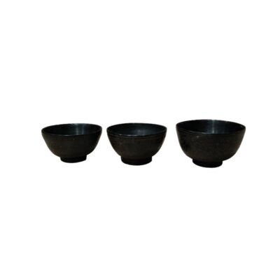 comprising three small bowls with a minimalist design, characterised by a dark-toned finish, gently curved sides and a small, raised circular base; available for hire for events, advertising, films and TV series