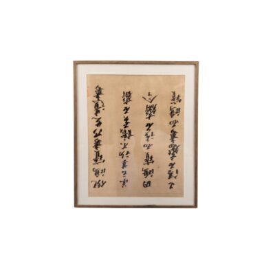 A traditional Chinese calligraphy piece on oatmeal-coloured paper, framed with a slim wooden border and a light-coloured mat, characterised by vertical columns of expressive strokes in dark ink and a distinctive red seal; available for hire for events, advertising, films and TV series