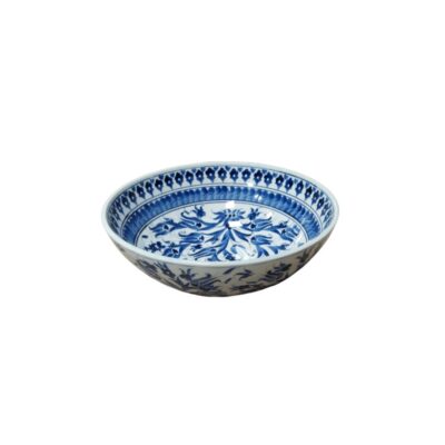 A circular white ceramic vessel, characterised by a classic design adorned with hand-painted floral and ornamental patterns in shades of cobalt blue on both the inside and outside; available for hire for events, advertising, films and TV series