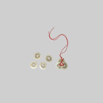 The set includes several traditional, antique-style coins with a square hole in the centre and inscriptions, some of which are strung together on a red thread. Available for hire for events, advertising, films and TV series.