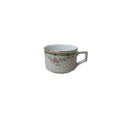 Small white porcelain mug with an elegant, classic design, featuring a side handle with angular, geometric shapes; available for hire for events, advertising, films and TV series