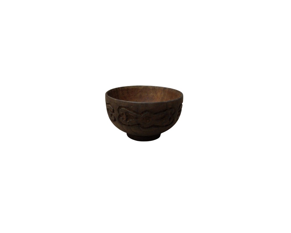A round wooden bowl in natural dark brown tones, characterised by a small circular base and a band carved in relief with geometric and curvilinear motifs around its body. Available for hire for events, advertising, films and TV series.