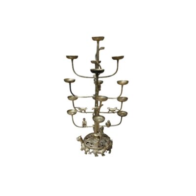 A vertical metal chandelier with an aged finish in shades of silver and gold, characterised by a tree-shaped structure with multiple staggered arms supporting circular discs, adorned with small figures of animals and characters on the trunk and a decorated circular base; available for hire for events, advertising, films and TV series