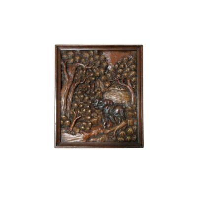 A rectangular dark wooden frame with intricate relief carving depicting a natural scene, featuring dense, leafy trees and animals in the centre; available for hire for events, advertising, films and TV series