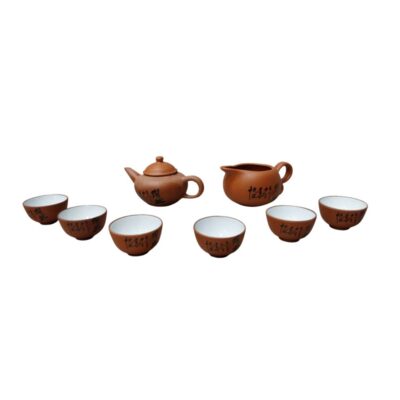 A traditional tea set comprising a small teapot, a serving jug and six matching cups. All the pieces are made from reddish clay with a natural matt finish on the outside and a white glazed interior. Available for hire for events, advertising, films and TV series.