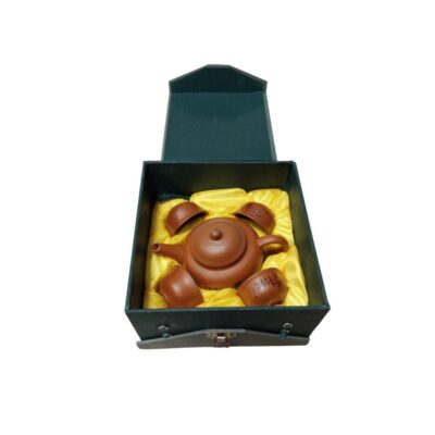 Traditional tea set comprising a clay teapot and several matching cups, carefully arranged inside a hard storage case; available for hire for events, advertising, films and TV series