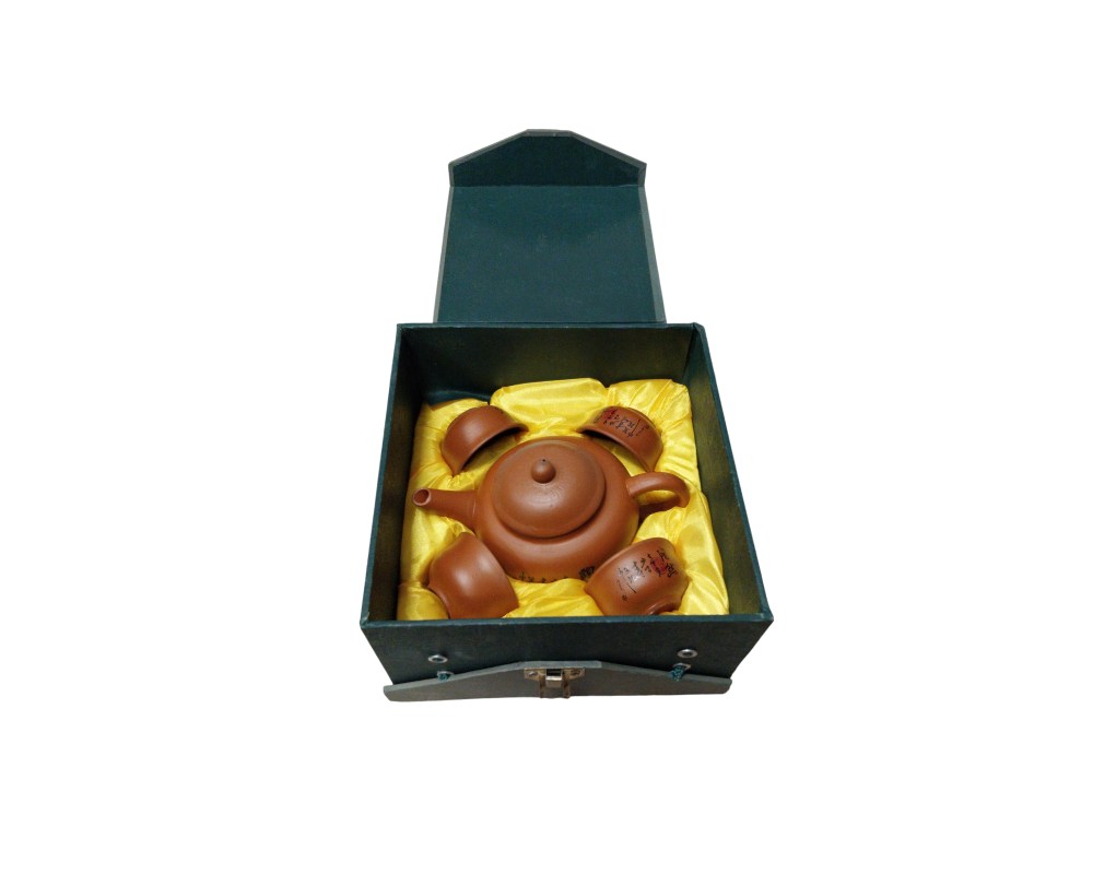 Traditional tea set comprising a clay teapot and several matching cups, carefully arranged inside a hard storage case; available for hire for events, advertising, films and TV series