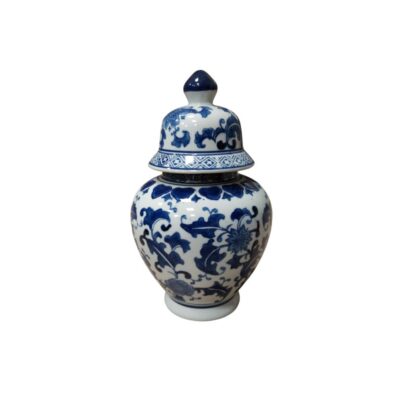 Porcelain ginger jar, characterised by its classic globular shape and its domed lid with a raised rim. The piece features traditional decoration painted in cobalt blue on a white background, with a detailed design of intertwined flowers and foliage covering both the body and the lid. Available for hire for events, advertising, films and TV series.
