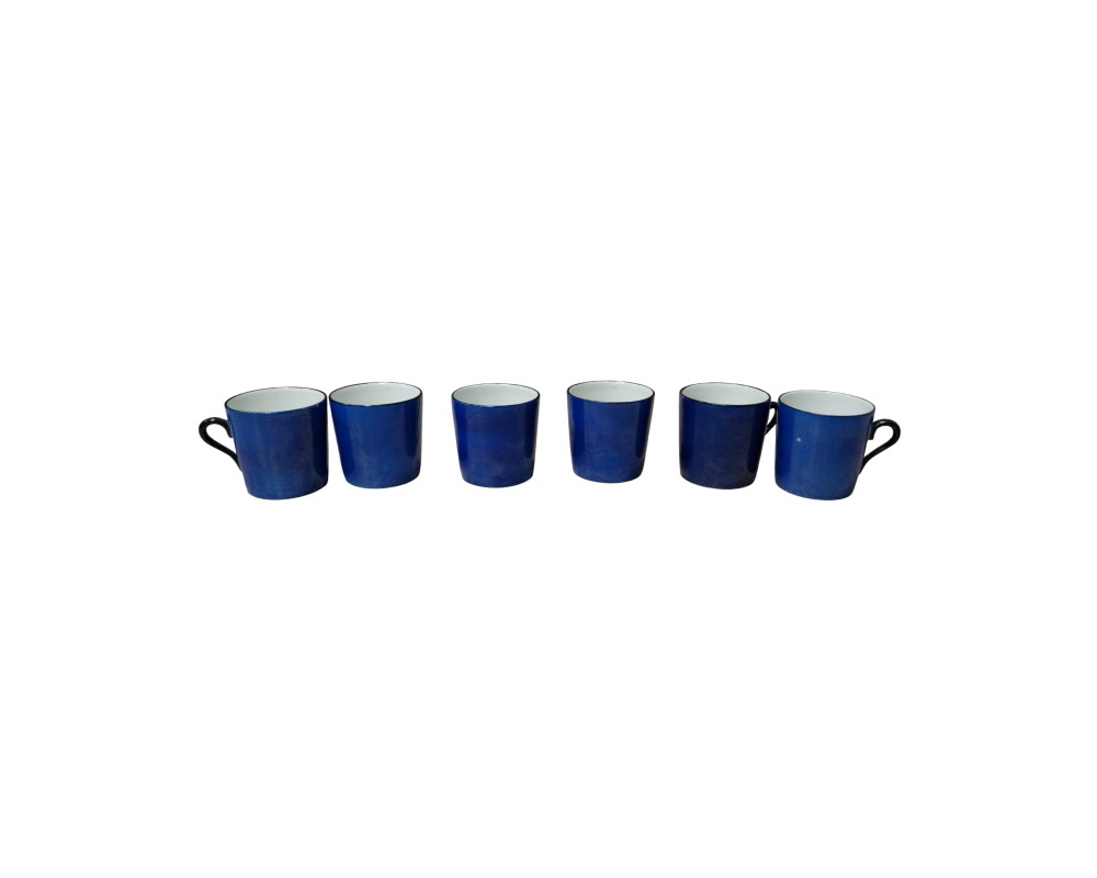 comprising six small cylindrical cups, characterised by an exterior finish in a deep blue shade and a contrasting white interior; available for hire for events, advertising, films and TV series