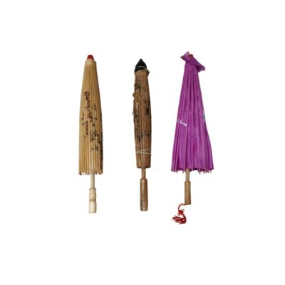 The set includes three small, traditional Oriental-style parasols or umbrellas in their closed position, with wooden frames and paper or fabric covers, featuring decorative printed designs and a variety of colours, including natural tones and purple. Available for hire for events, advertising, films and TV series.