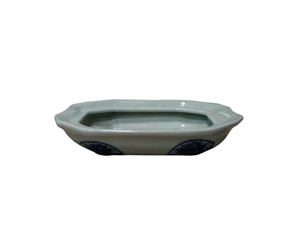 Rectangular porcelain tray with bevelled corners, giving it an octagonal shape; available for hire for events, advertising, films and TV series