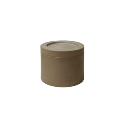 A cylindrical container with a solid appearance and neutral earthy tones, characterised by a clean, minimalist design featuring a flat lid that is perfectly integrated into its structure; available for hire for events, advertising, films and TV series