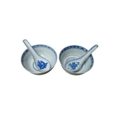 The set comprises two ceramic bowls with a rounded design and a stable base, accompanied by their respective traditional soup spoons. Available for hire for events, advertising, films and TV series.
