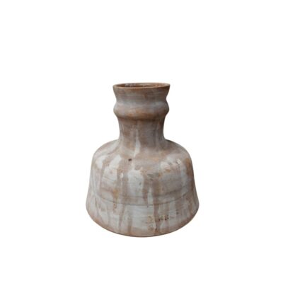 Ceramic vase with a wide base and a slender neck, characterised by a rustic finish in light and brown tones with a dripping effect; available for hire for events, advertising, films and TV series