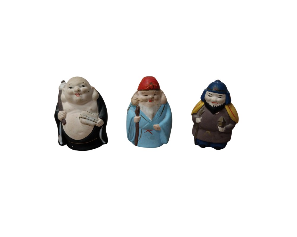 The set comprises three small ceramic figurines, hand-painted in distinctive colours, depicting archetypal characters from Eastern tradition. Available for hire for events, advertising, films and TV series.