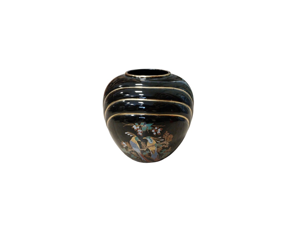 A ceramic vase with a globular body and a glossy black finish, featuring gold horizontal lines running across the top and a delicate polychrome illustration on the front depicting birds perched on flowering branches; available for hire for events, advertising, films and TV series