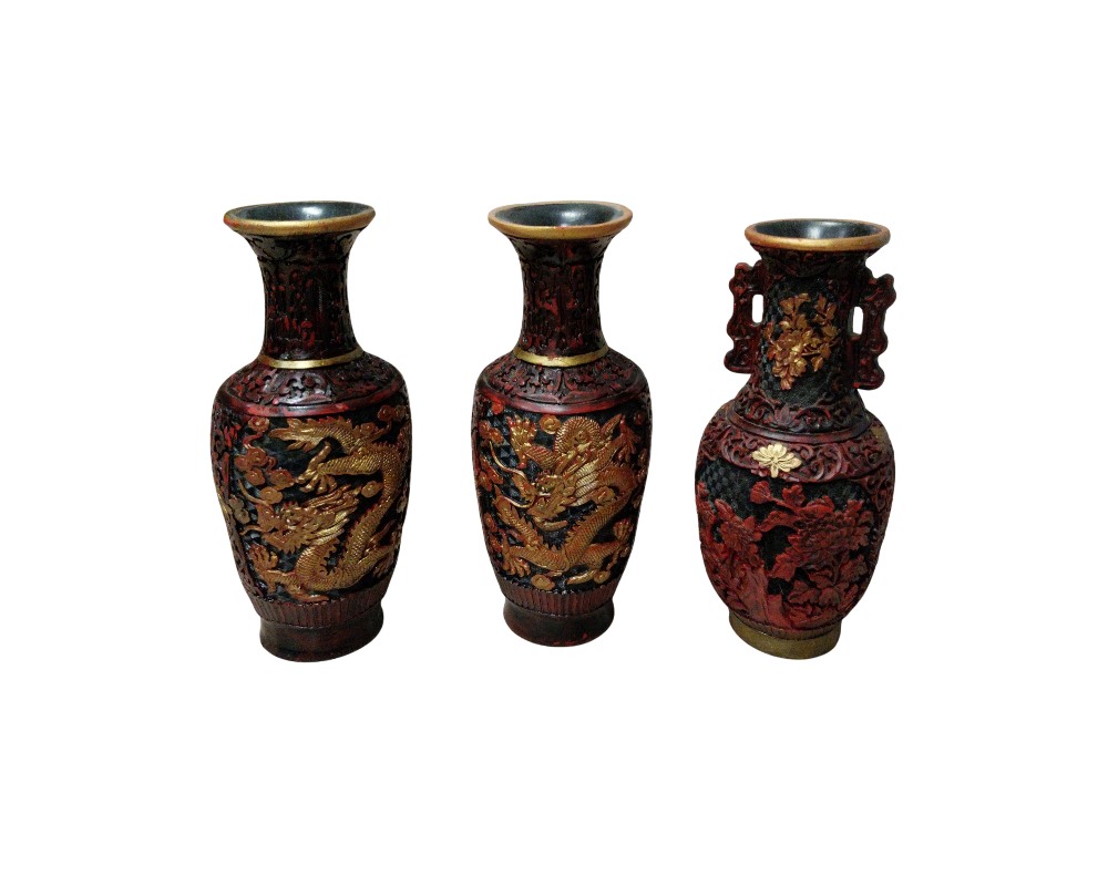 comprising three traditionally designed vases with intricate detailing in dark, red and gold tones; available for hire for events, advertising, films and TV series