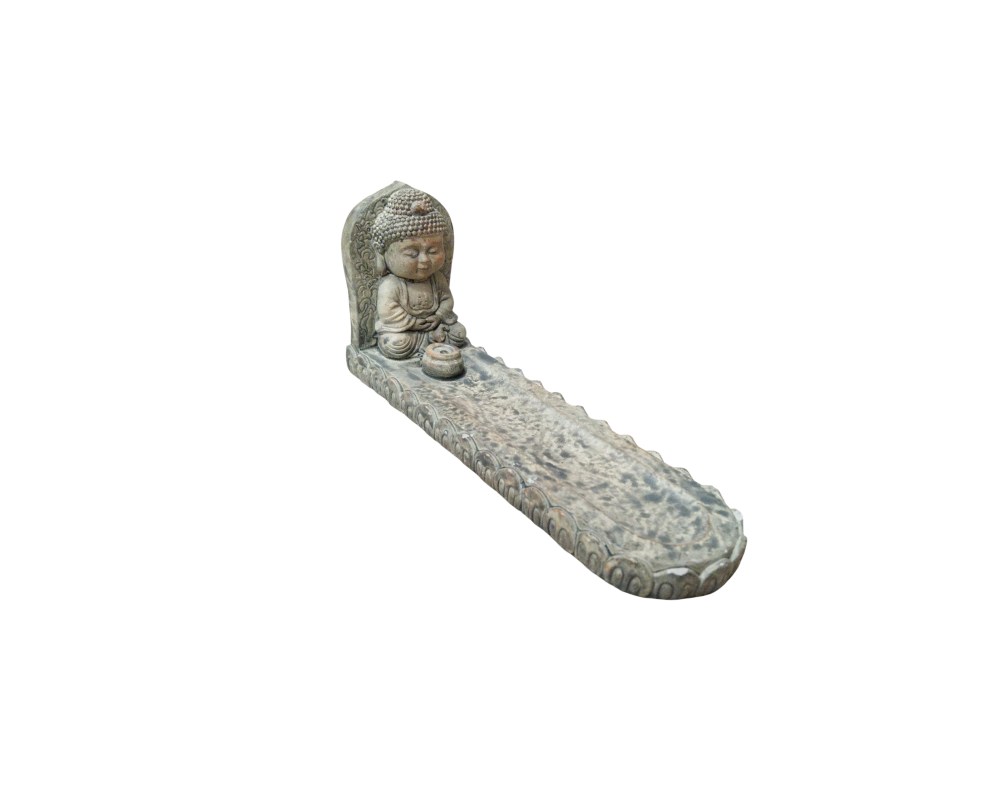 A decorative incense burner carved from a material that resembles stone, featuring a small figure of the Buddha in a meditative pose at one end; available for hire for events, advertising and films