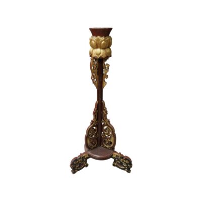 A vertical wooden candelabra with dark and gold finishes, characterised by an intricate openwork carved design, an upper section sculpted in the shape of a lotus flower, and a stable tripod base; available for hire for events, advertising, films and TV series
