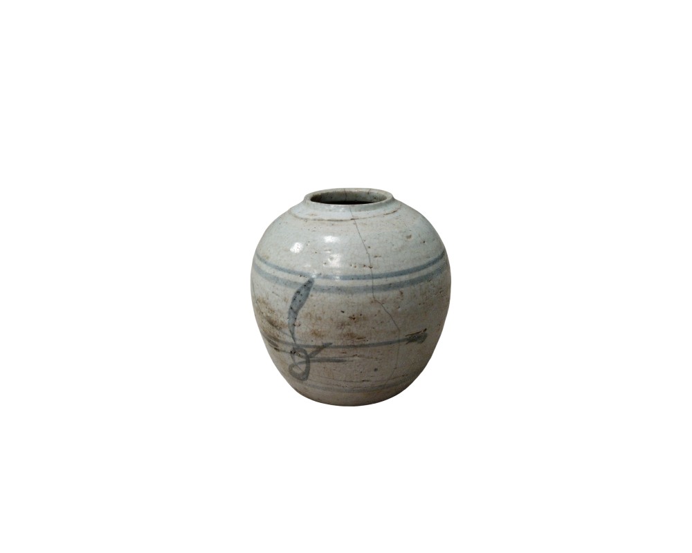 A ceramic vase with a compact, globular body and a narrow mouth, finished in light, rustic tones featuring fine horizontal lines and a stylised pictorial motif painted in shades of blue and grey; available for hire for events, advertising, films and TV series