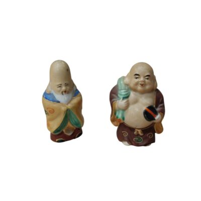 A pair of small porcelain figurines depicts two archetypal characters from Eastern tradition, often associated with longevity and prosperity. Available for hire for events, advertising, films and TV series.