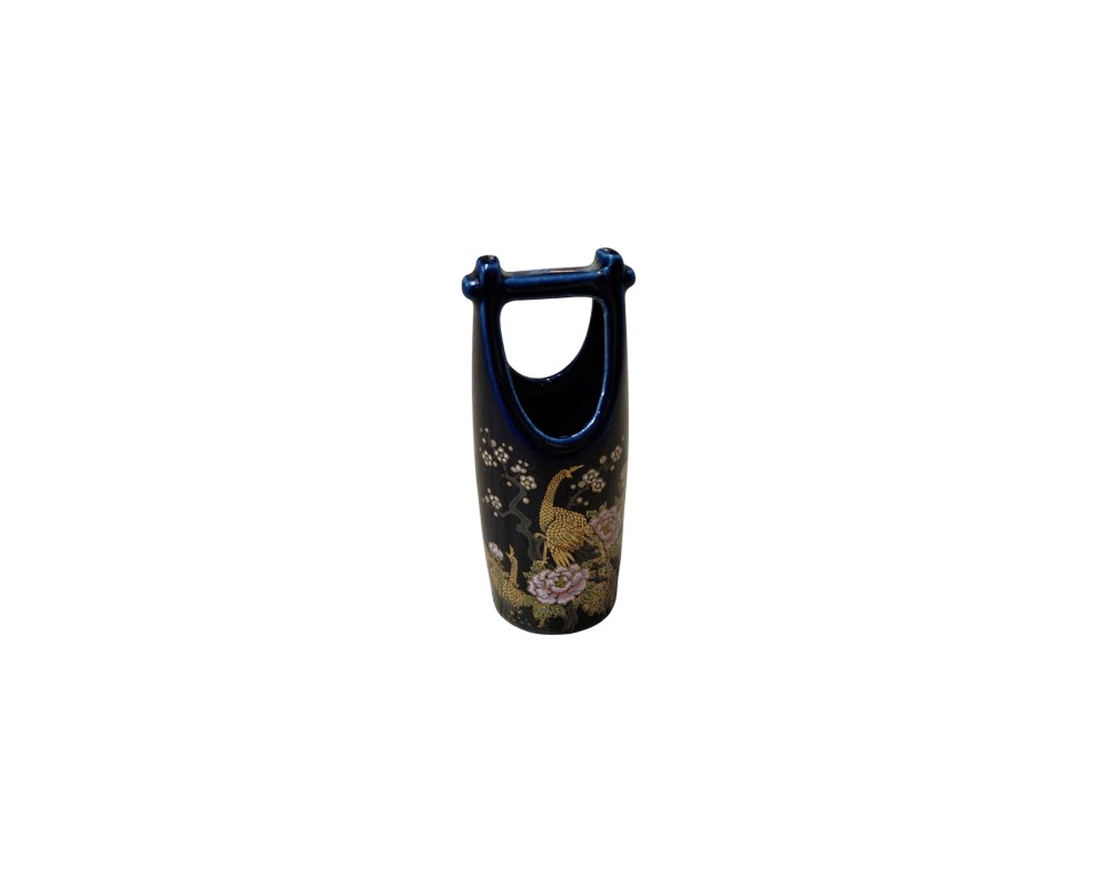 a ceramic container with a distinctive arched handle at the top, giving it a shape similar to a small basket; available for hire for events, advertising, films and TV series