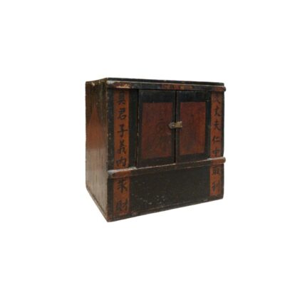 A compact wooden cabinet in the traditional Chinese style, designed for use on surfaces such as tables or desks. It features front doors and panels decorated in dark and red tones, incorporating vertical inscriptions in Chinese calligraphy. It is a functional piece for storing personal items, documents or office supplies, whilst also serving as a decorative element for hire at events, in advertising, films and TV series.