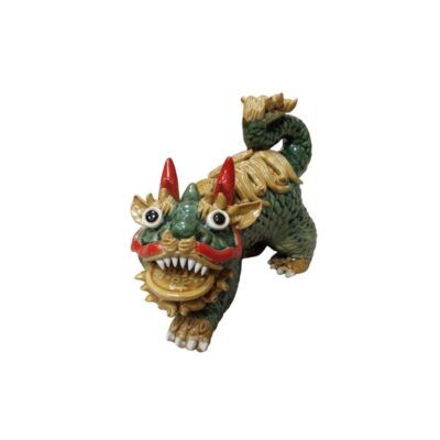 A glazed ceramic figurine depicting a Qilin, a mythical creature from Eastern mythology. The figurine stands out for its colourful finish in shades of green and ochre, with red detailing on the face and horns. Available for hire for events, advertising, films and TV series.