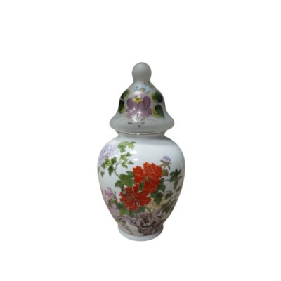 A porcelain vase with a globular body and a stable base, characterised by a slender top with a rounded rim and a surface decorated with a detailed floral arrangement in shades of red, purple and green, featuring foliage; available for hire for events, advertising, films and TV series
