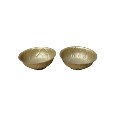 consisting of two small metal bowls with a shiny gold-coloured finish, characterised by an interior and exterior design that mimics raised petals or lobes around their sides; available for hire for events, advertising, films and TV series