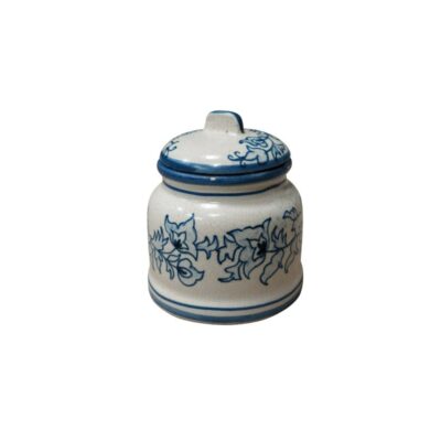 A ceramic container with a lid, featuring a distinctive crackled finish that gives it an antique texture and appearance. The piece features a simple and elegant design in cobalt blue. Available for hire for events, advertising, films and TV series.