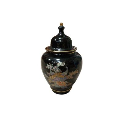 A ceramic vase with a rounded body and a glossy black finish, featuring a tall lid adorned with a knob on top and gold detailing; available for hire for events, advertising, films and TV series