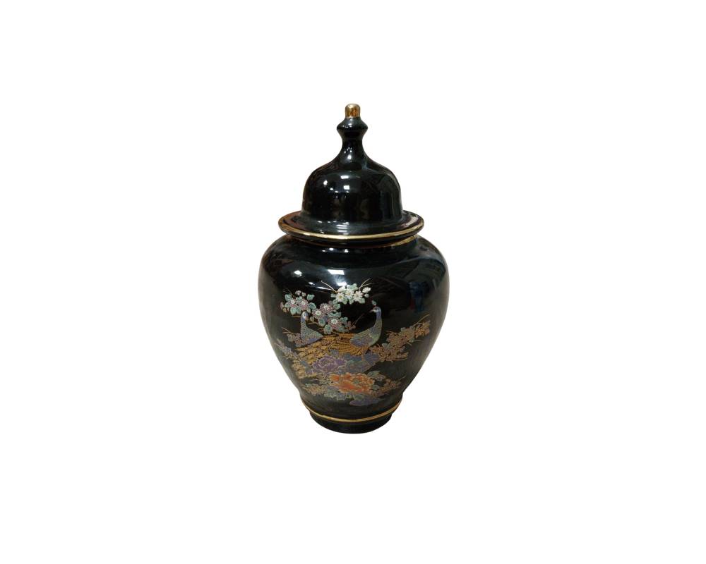 A ceramic vase with a rounded body and a glossy black finish, featuring a tall lid adorned with a knob on top and gold detailing; available for hire for events, advertising, films and TV series
