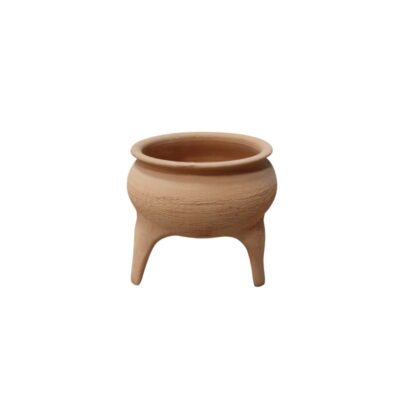 A ceramic bowl in natural terracotta tones, characterised by a globular body with a rough texture, a rounded and flared upper rim, and three short supporting legs; available for hire for events, advertising, films and TV series