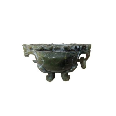 An ornamental stone object with a marbled finish in dark green tones, designed with a globular body resting on three sculpted legs and featuring side handles with rings and zoomorphic details; available for hire for events, advertising, films and TV series