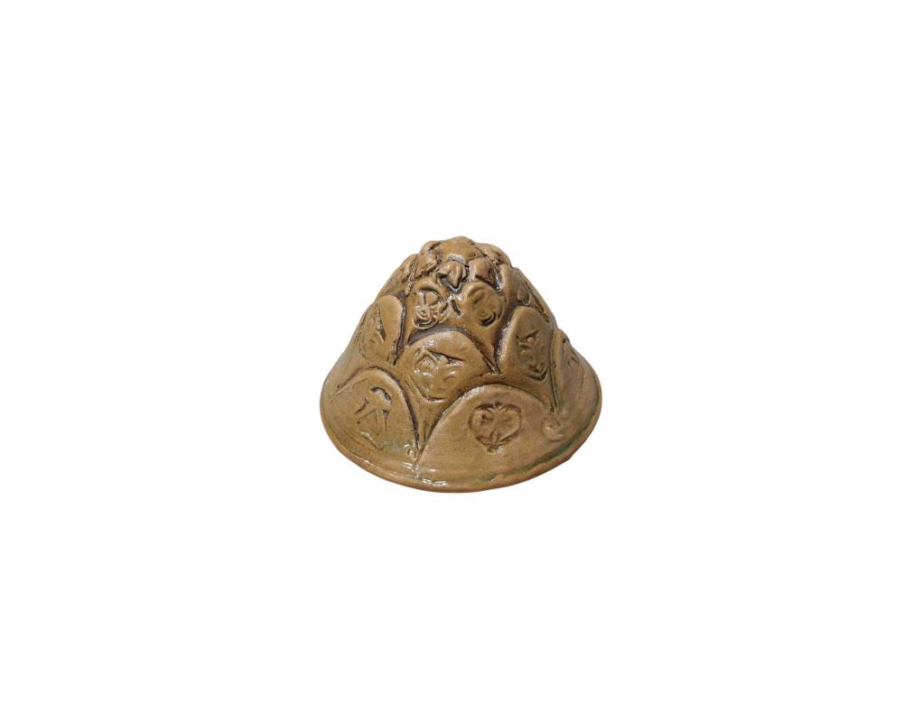 Conical ceramic lid with a glazed finish in shades of brown and ochre, featuring a raised design resembling petals; available for hire for events, advertising, films and TV series