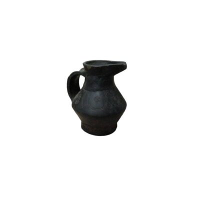 Small ceramic jug with a monochrome finish in dark shades, featuring an angular, globular body, a stable base and a pronounced spout; available for hire for events, advertising, films and TV series