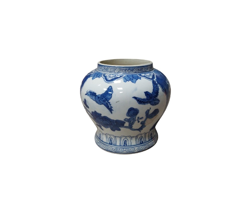 A porcelain vase with a globular body, a short neck and a slightly flared base. It features traditional decoration in cobalt blue on a white background, a technique very characteristic of Oriental ceramics. Available for hire for events, advertising, films and TV series.