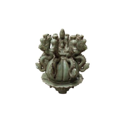 This piece is an elaborate ornamental ceramic sculpture with a glazed finish in celadon green tones, in a traditional style, available for hire for events, advertising, films and TV series