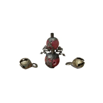 consisting of a vertical centrepiece comprising two reddish spherical sections decorated with metal appliqués featuring sculpted dragons and an upper neck, flanked on either side by two small open metal bells with rings; available for hire for events, advertising, films and TV series