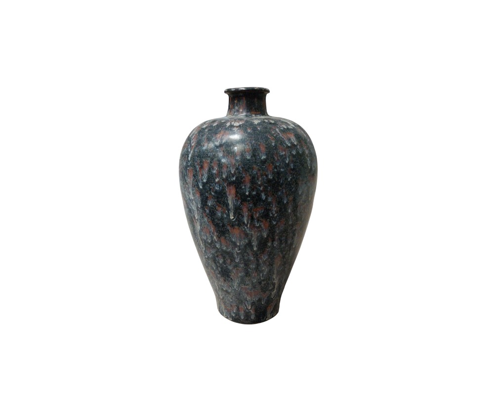 A ceramic vase with a slender body and short neck, characterised by an intricate glazed finish that blends dark tones with reddish and whitish highlights to create a dripping effect; available for hire for events, advertising, films and TV series