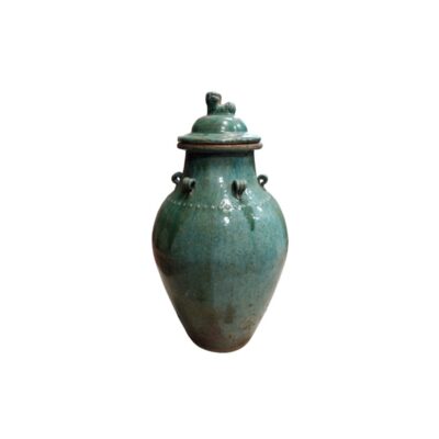 A ceramic vase with a glossy glaze in shades of turquoise green and an aged patina, characterised by a globular body, small decorative handles or rings on the shoulder, a line of raised dots and a lid crowned by a small sculpted figure; available for hire for events, advertising, films and TV series