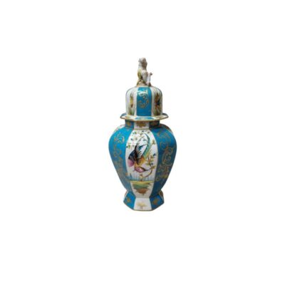 A faceted porcelain vase with a striking deep turquoise background, combined with gold ornamental details and white panels featuring intricate depictions of birds and plant motifs; available for hire for events, advertising, films and TV series