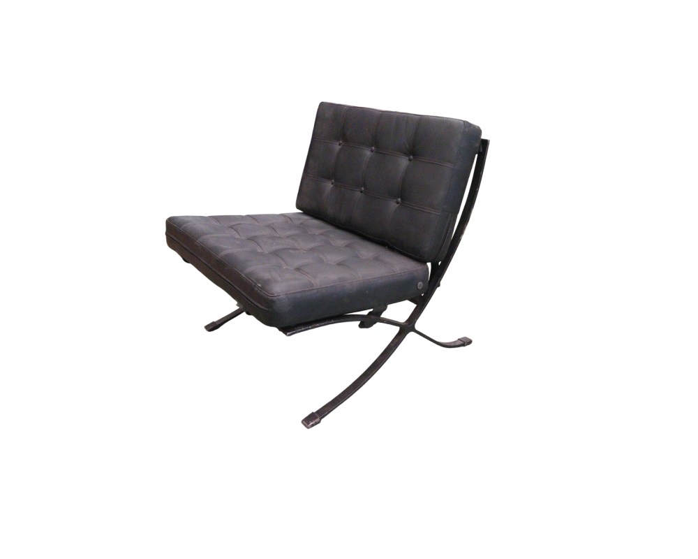 A vintage armchair with a modern design, featuring a padded seat and backrest with a tufted pattern, upholstered in black leather or imitation leather, supported by a distinctive cross-shaped metal frame with curved legs. Available for hire for events, advertising, films and TV series.