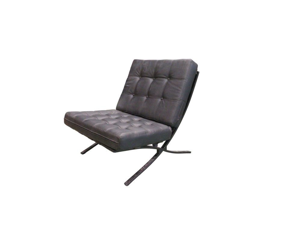 Iconic vintage armchair with a modern design, featuring a padded seat and backrest with a tufted pattern, upholstered in leather; available for hire for events, advertising, films and TV series