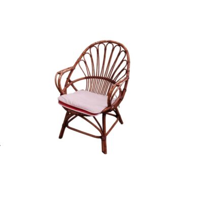 Vintage armchair made with a bamboo and natural rattan frame, characterised by a distinctive backrest of arched rods arranged in a radial pattern and integrated armrests, also featuring a comfortable seat cushion in light colours; available for hire for events, advertising, films and TV series